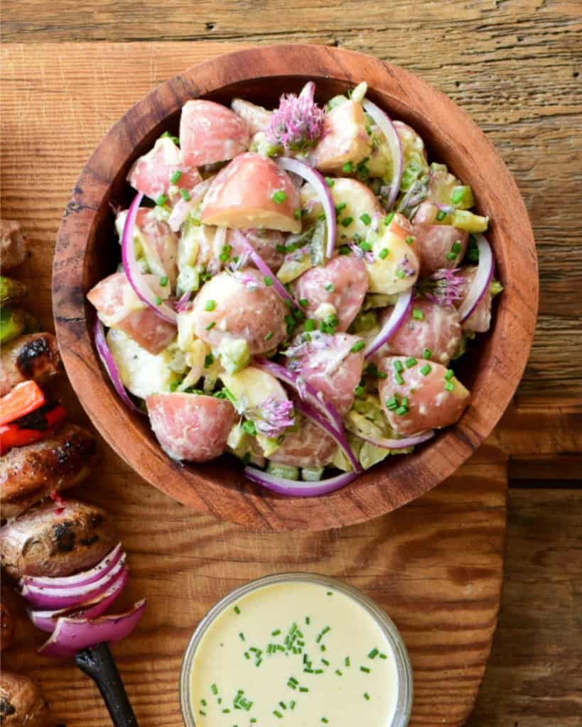 A dill pickle salad in a wooden bowl.