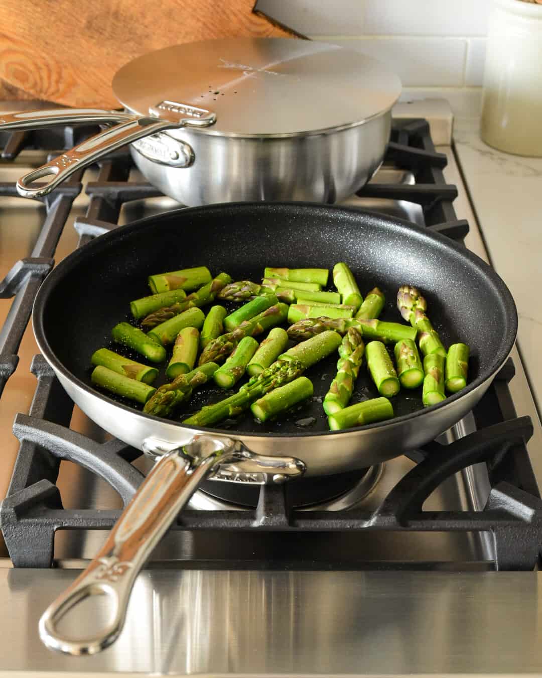 Asparagus cooking in a non-stick pan.
