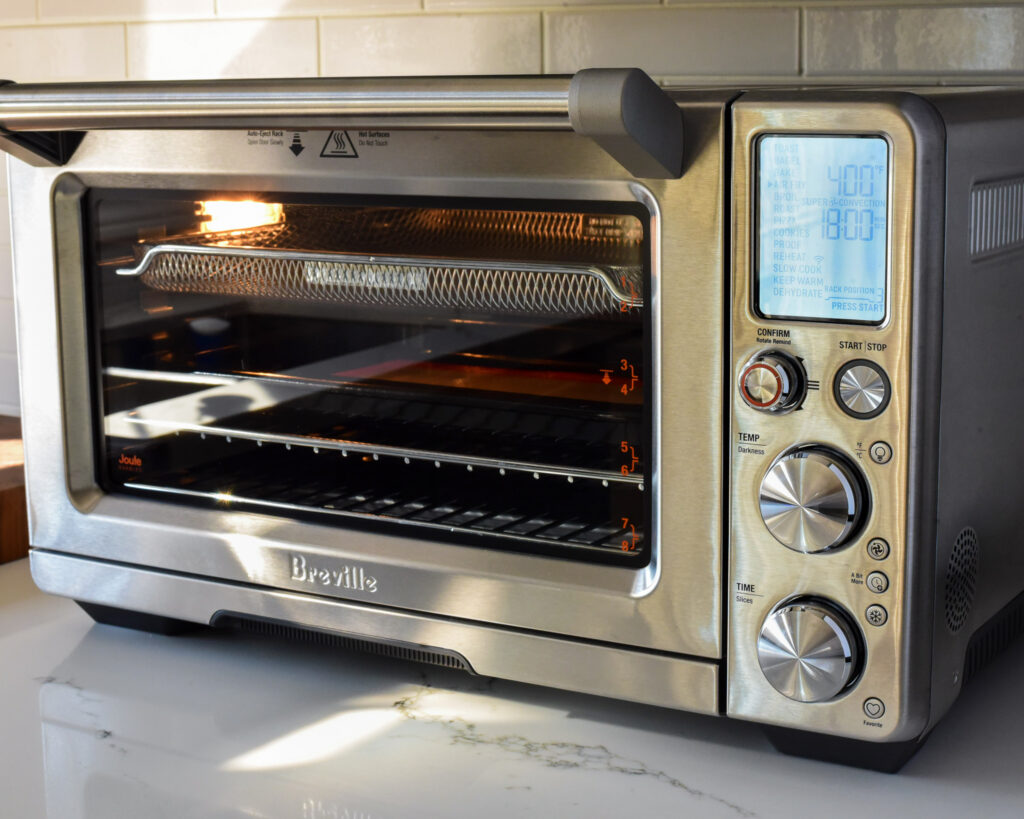 A close up image of an air fryer and the control panel.