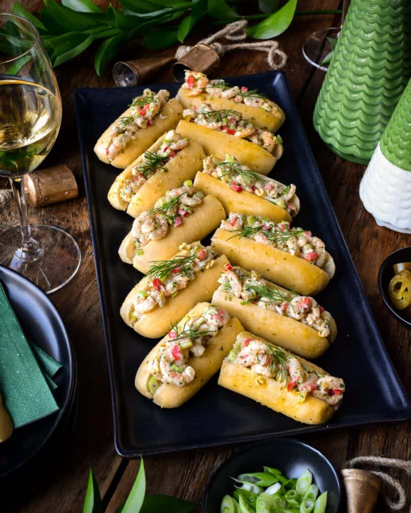 A platter of shrimp roll appetizers laid out in a chevron pattern.
