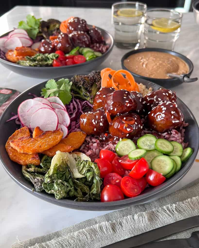 A healthy, vegan bowl of Thai meatballs and veggies.