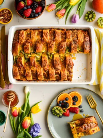 Savoury French Toast Casserole served with fresh fruit for Easter brunch.