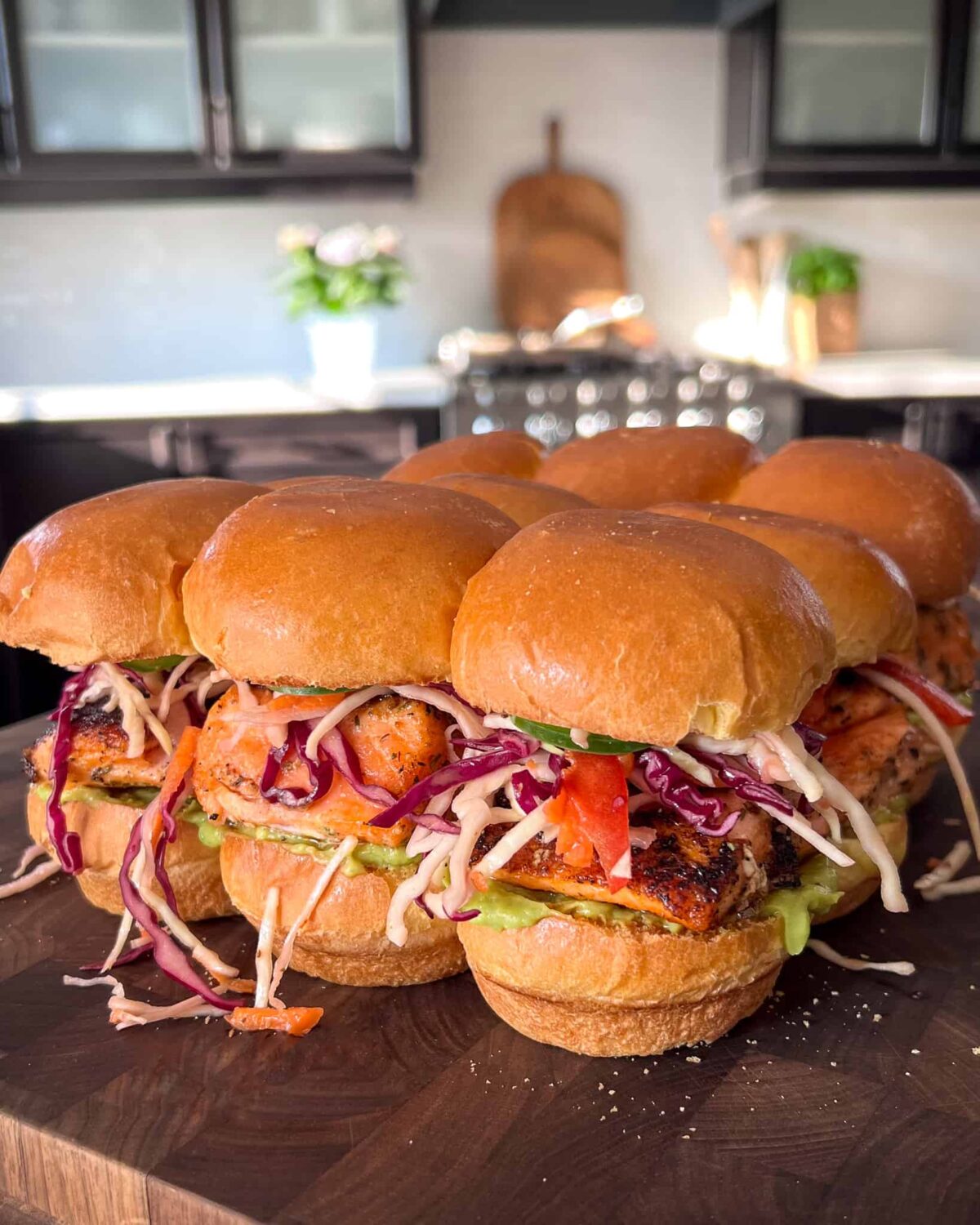 Nine blackened salmon sliders with rainbow slaw.