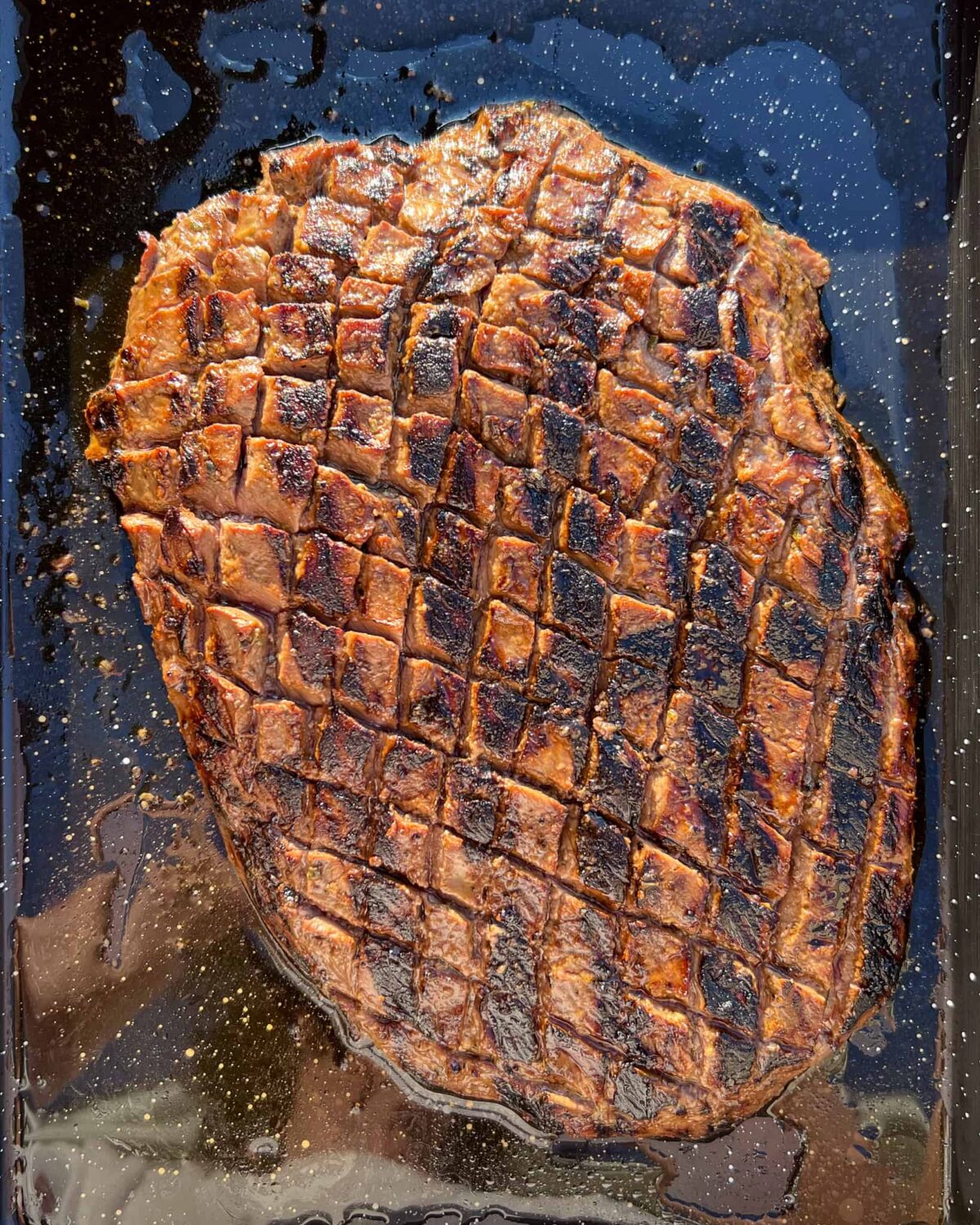 A seared crosshatched flank steak.
