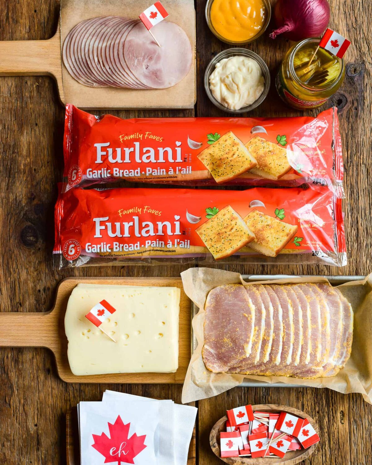 Ingredients of a Cuban sandwich laid out.