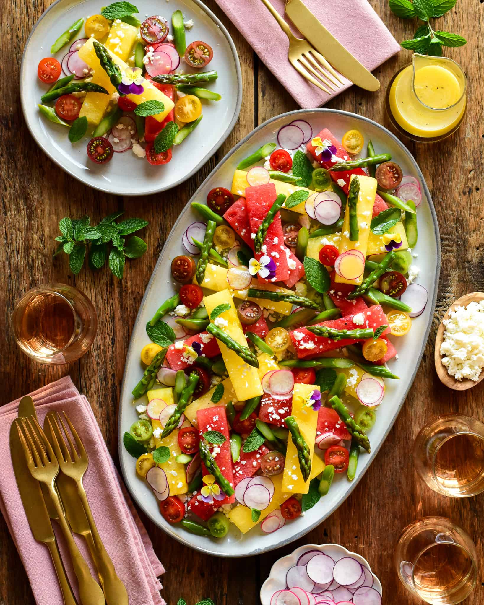 A plater of compressed watermelon salad with sous-vide asparagus.