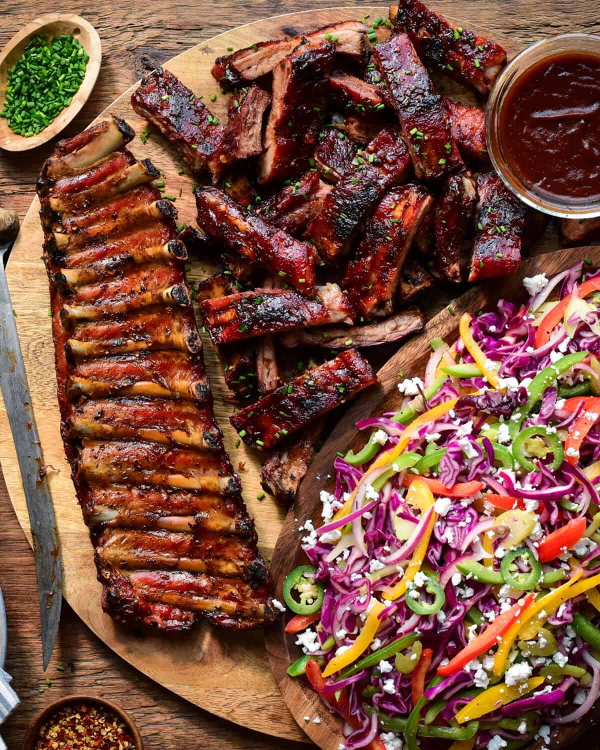 A pile of BBQ Baby Back Ribs with Psychedelic Slaw.