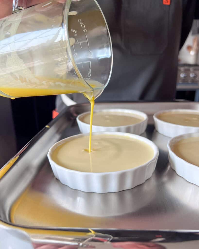 Pour the cream egg mixture into the ramekins.