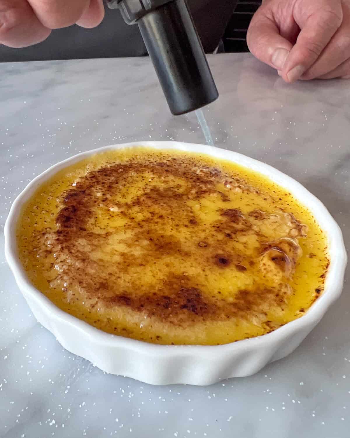 . Use a kitchen torch to caramelize the tops until the sugar melts and browns
