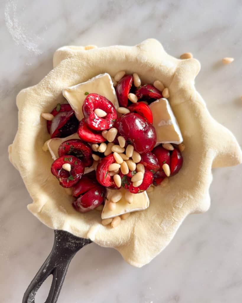 A mini puff pastry filled with cherries, Brie and pine nuts.