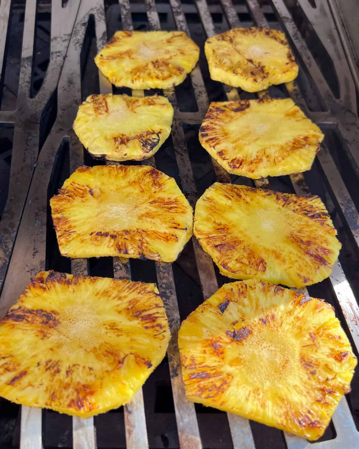 Grill the pineapple slices until light grill marks appear.