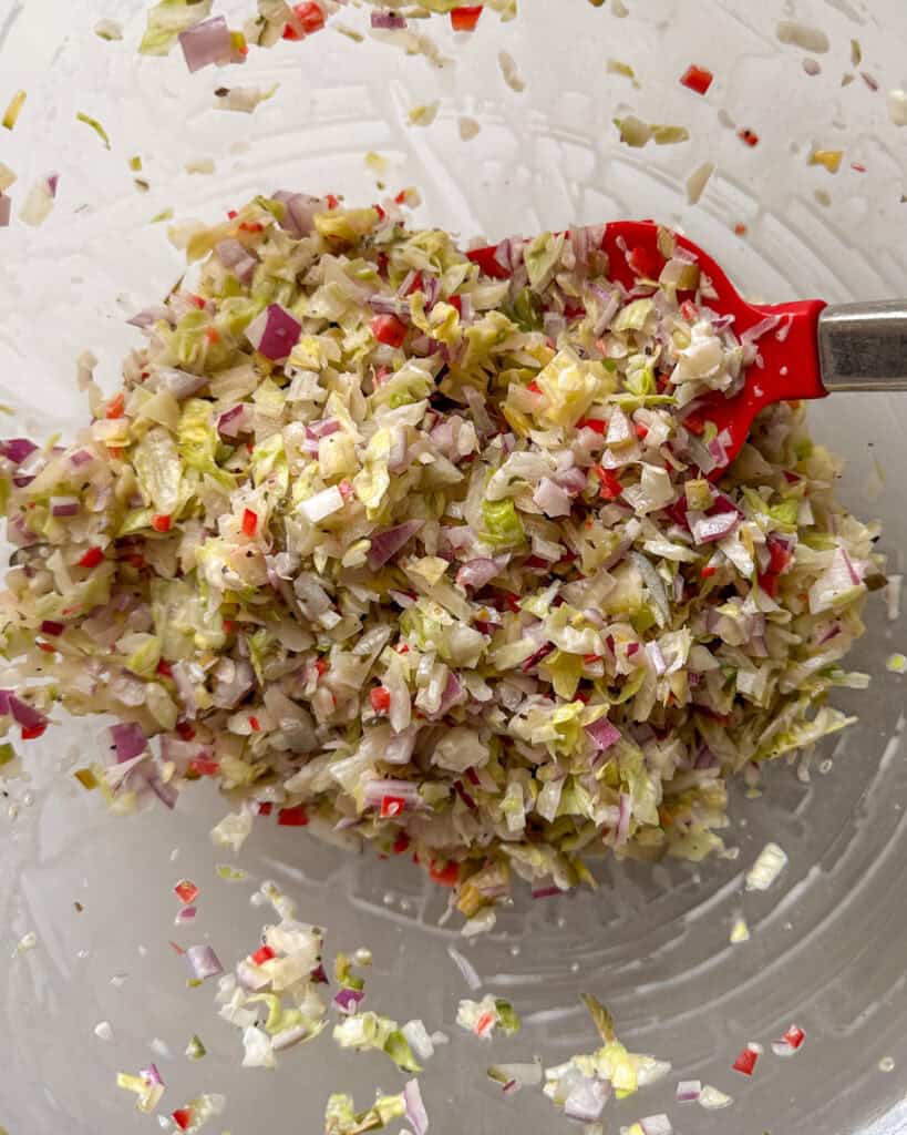 A bowl of chopped salad for an Italian sliders recipe.