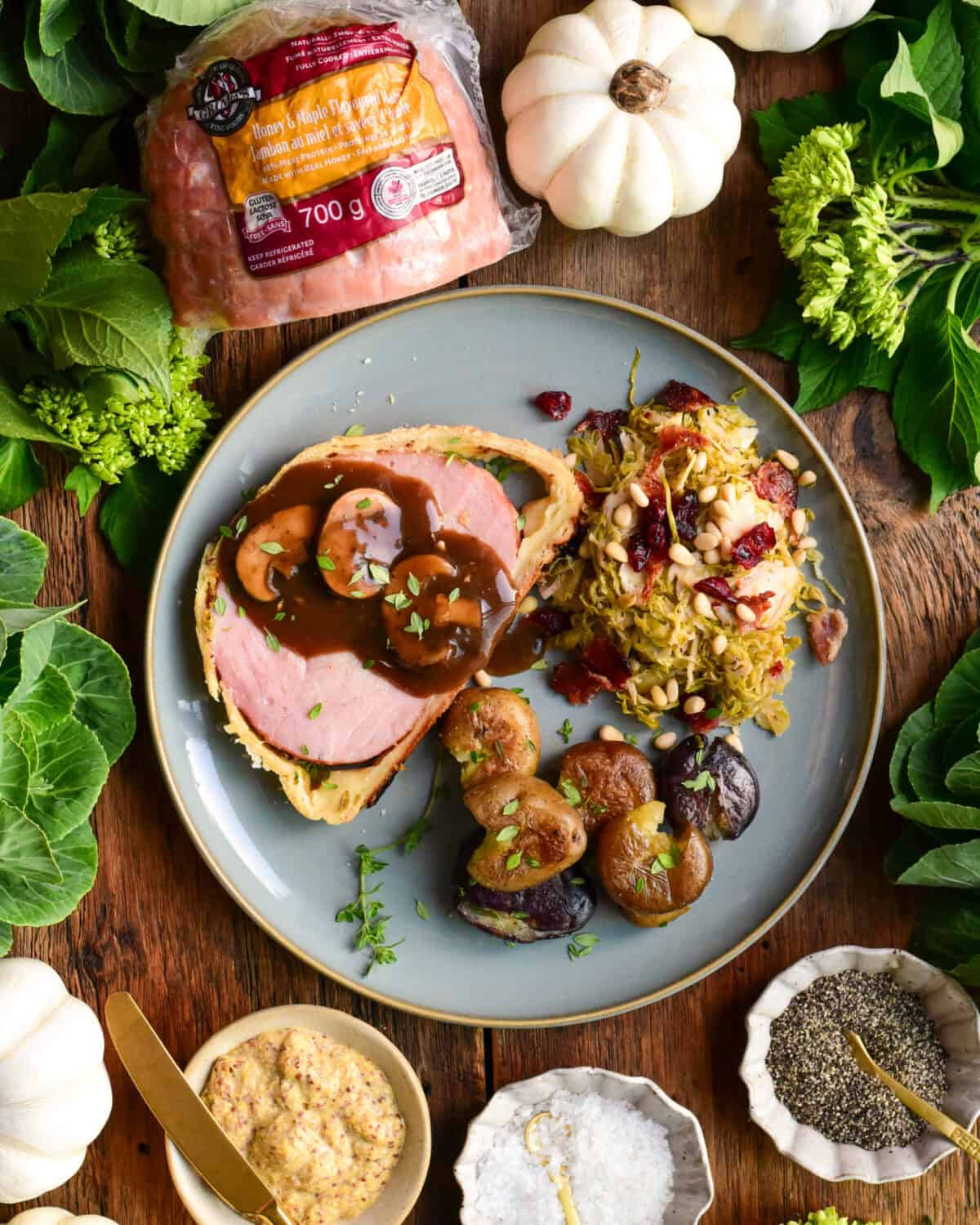Serve with extra mustard and garnish with fresh thyme. We served it here with a Marsala Mushroom Sauce, Shredded Brussels Sprouts with Pine Nuts and Pancetta, and smashed potatoes with thyme.