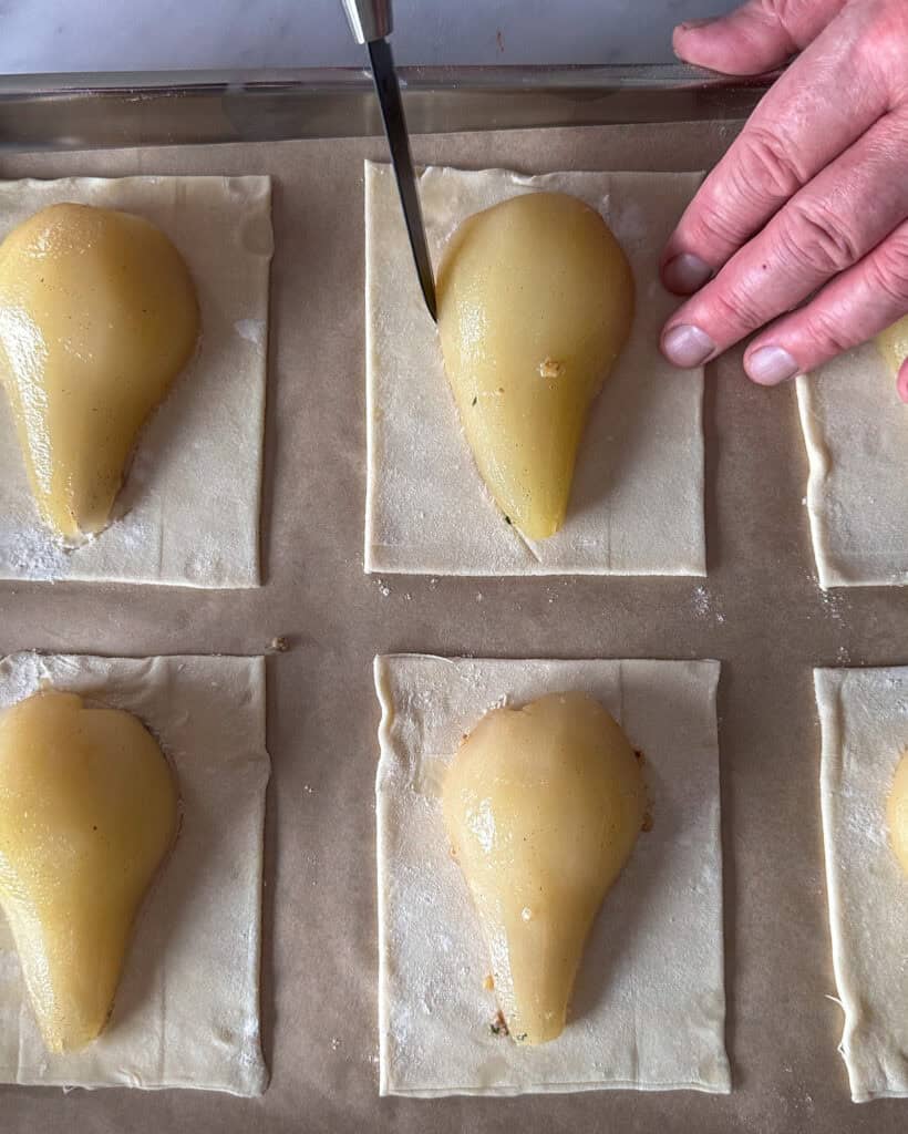 Score the puff pastry around the pear.