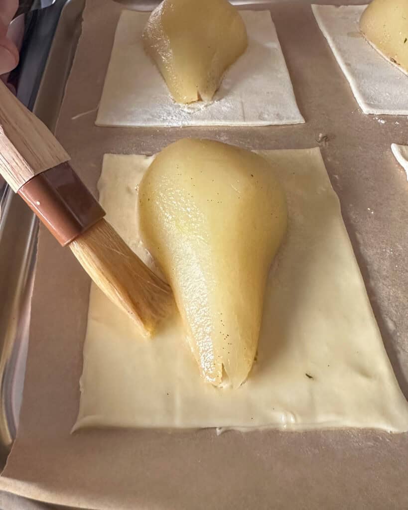 Brush the egg wash over each of the puff pastries.