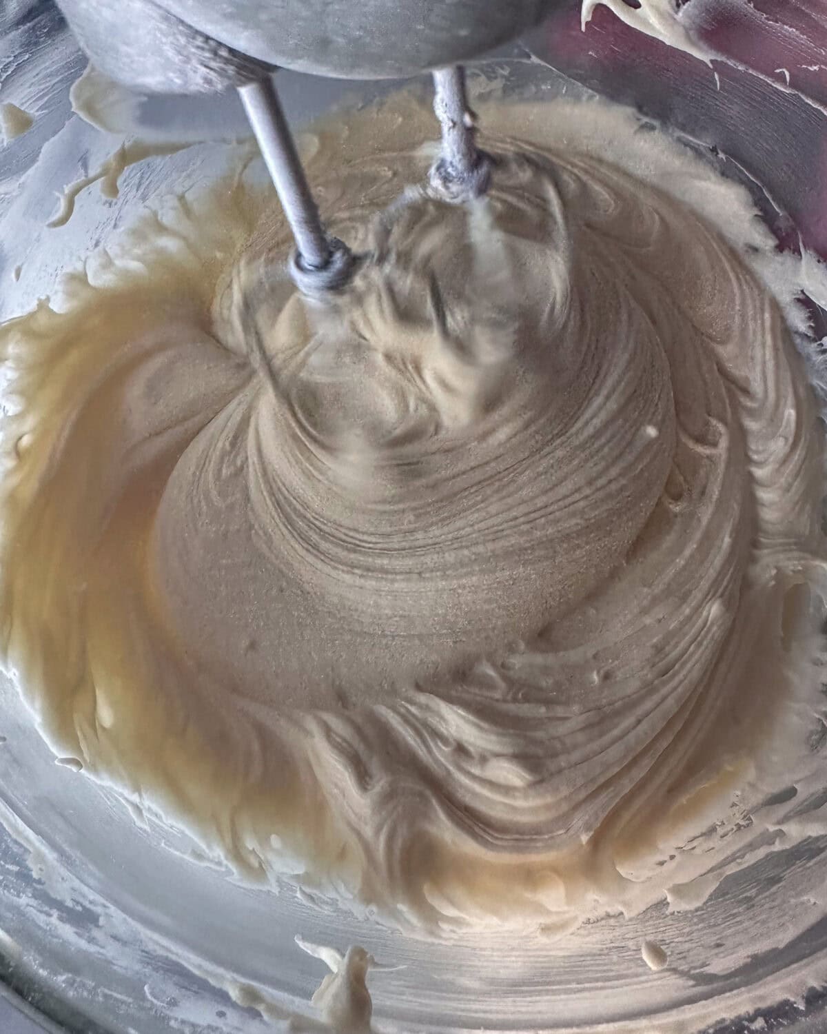 Frosting getting whipped up.