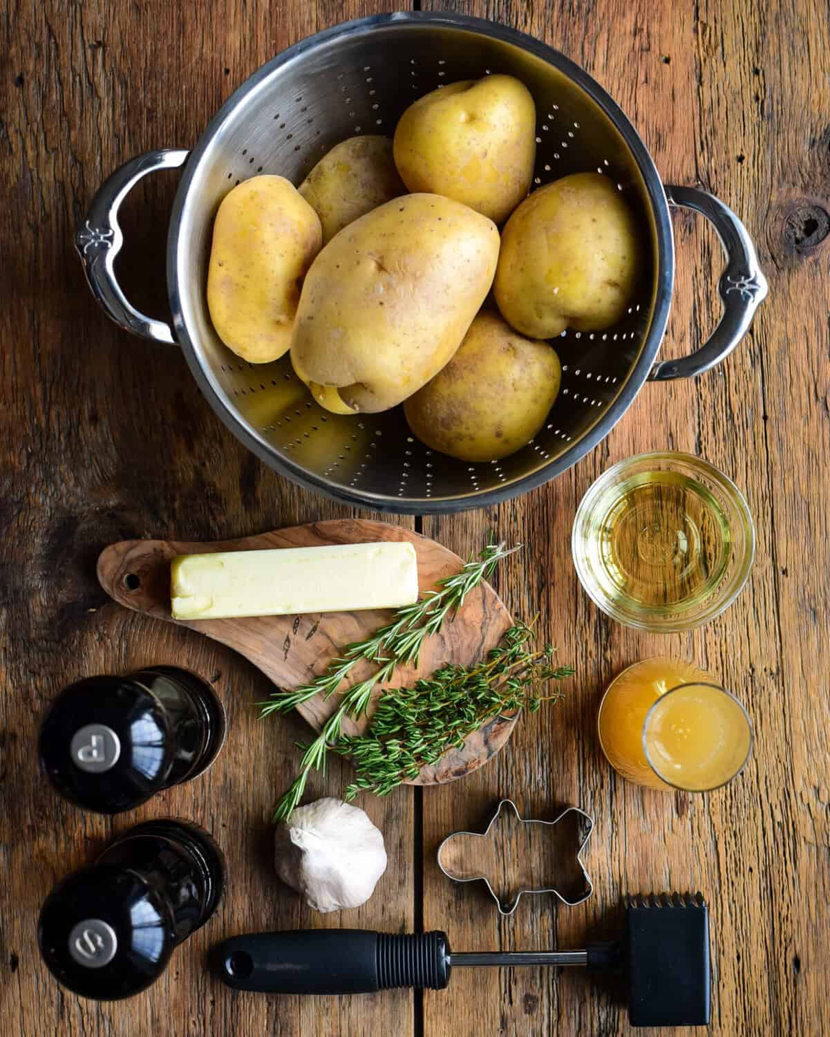 Ingredients laid out to make a fondant potato recipe.