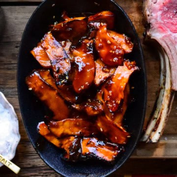 A bowl of grilled gochujang baby king oyster mushrooms.