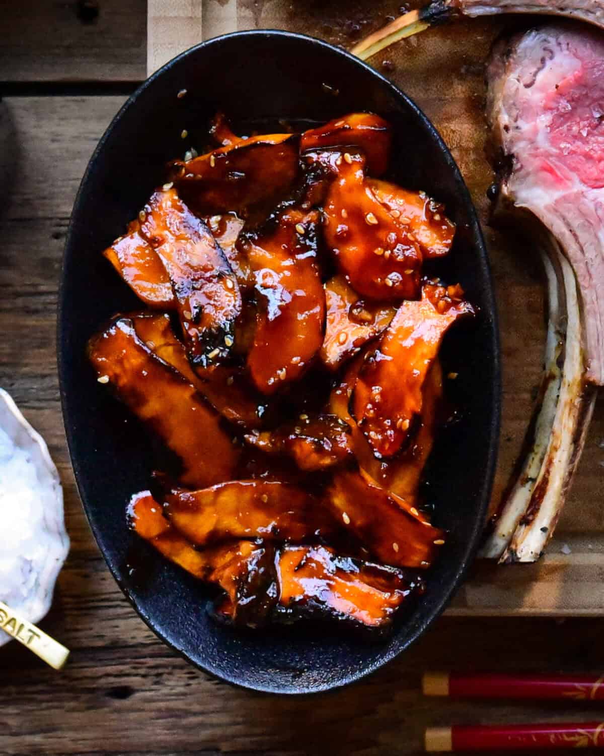 A bowl of grilled gochujang baby king oyster mushrooms.