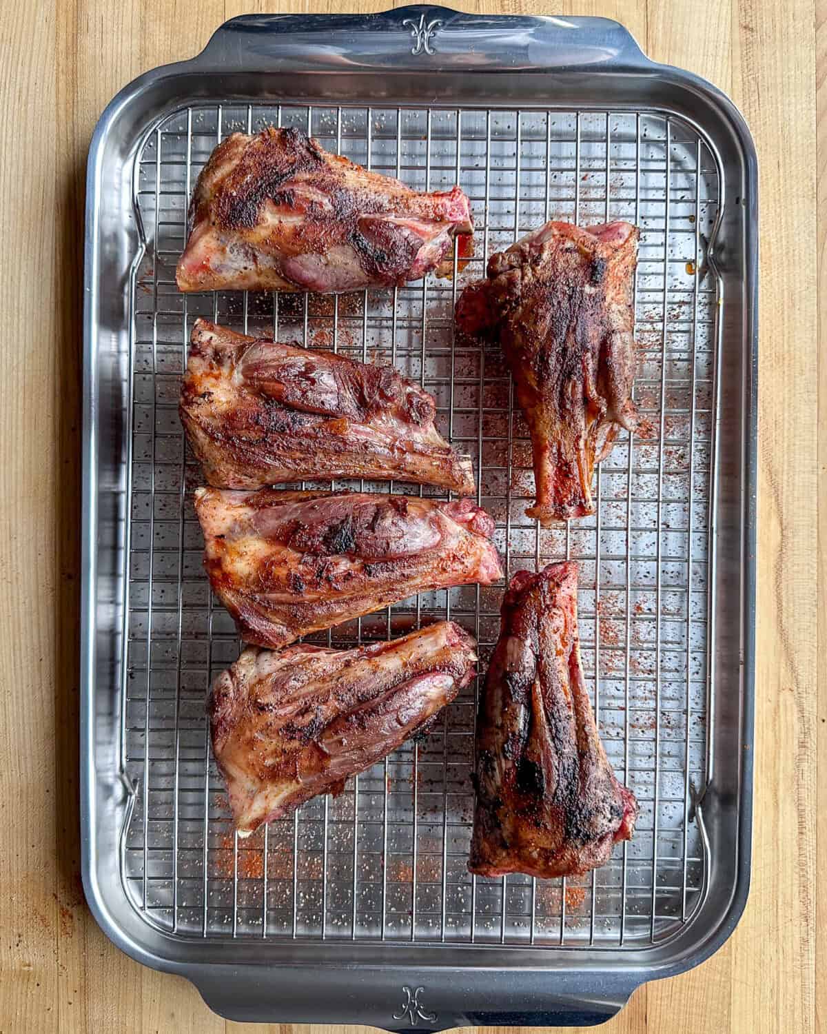 Sear lamb shanks until browned on each side.