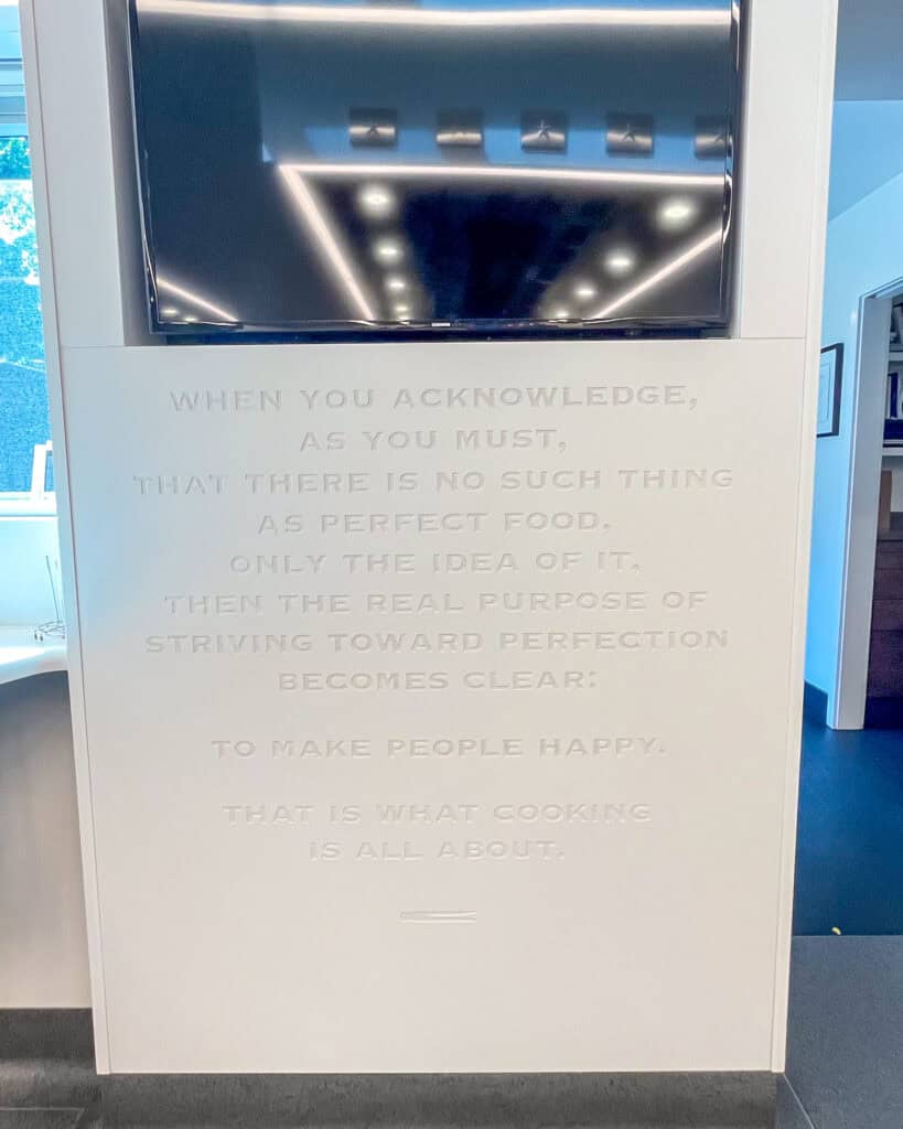A close up of a quote on the wall in The French Laundry Kitchen.