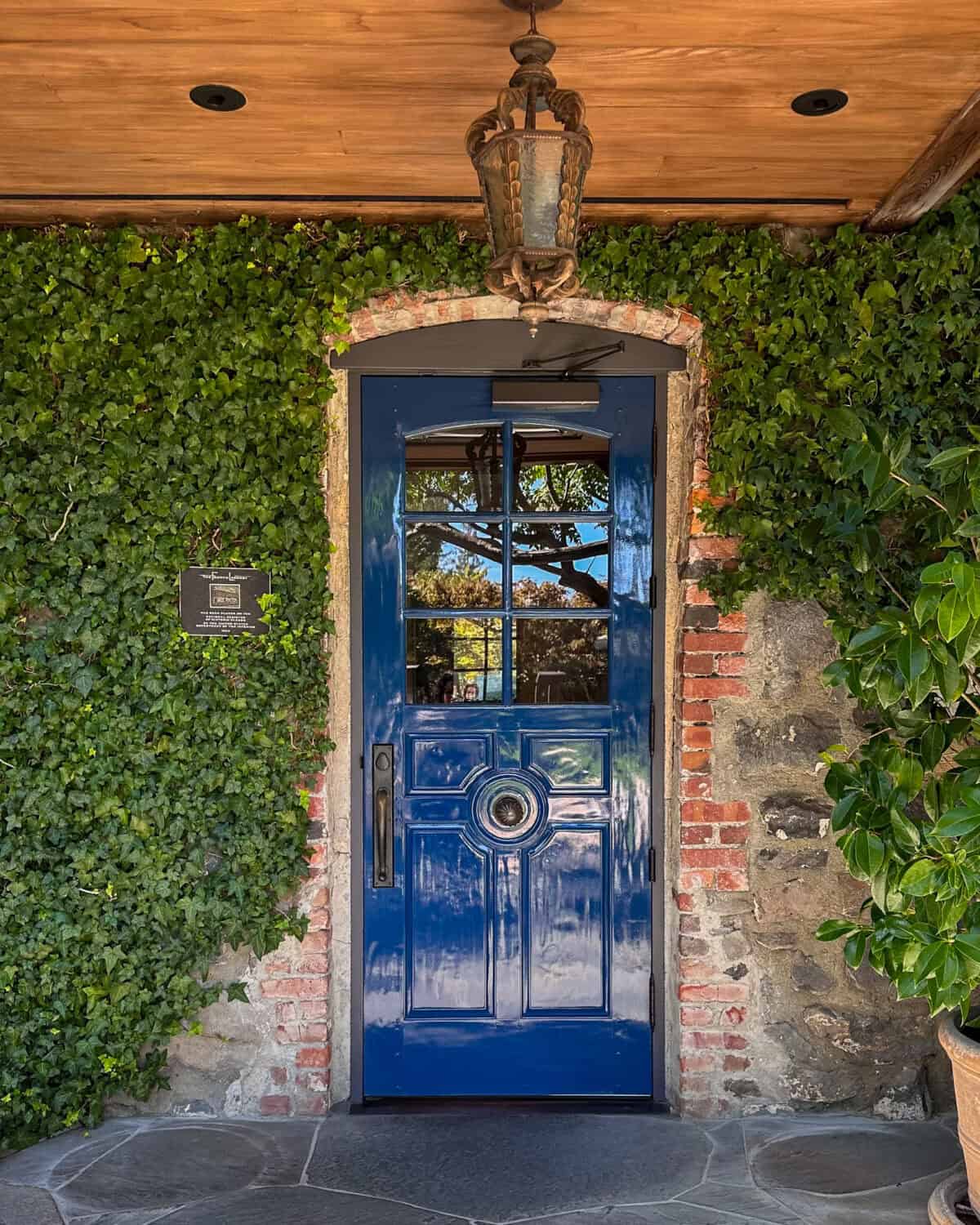 The French Laundry with its iconic blue door and ivy-covered façade.
