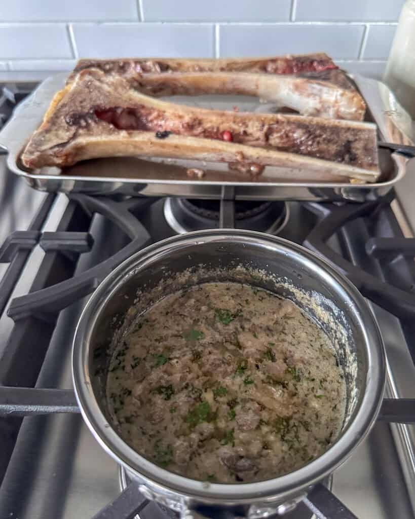 Scoop the bone marrow from the bone and add it to the garlic butter.