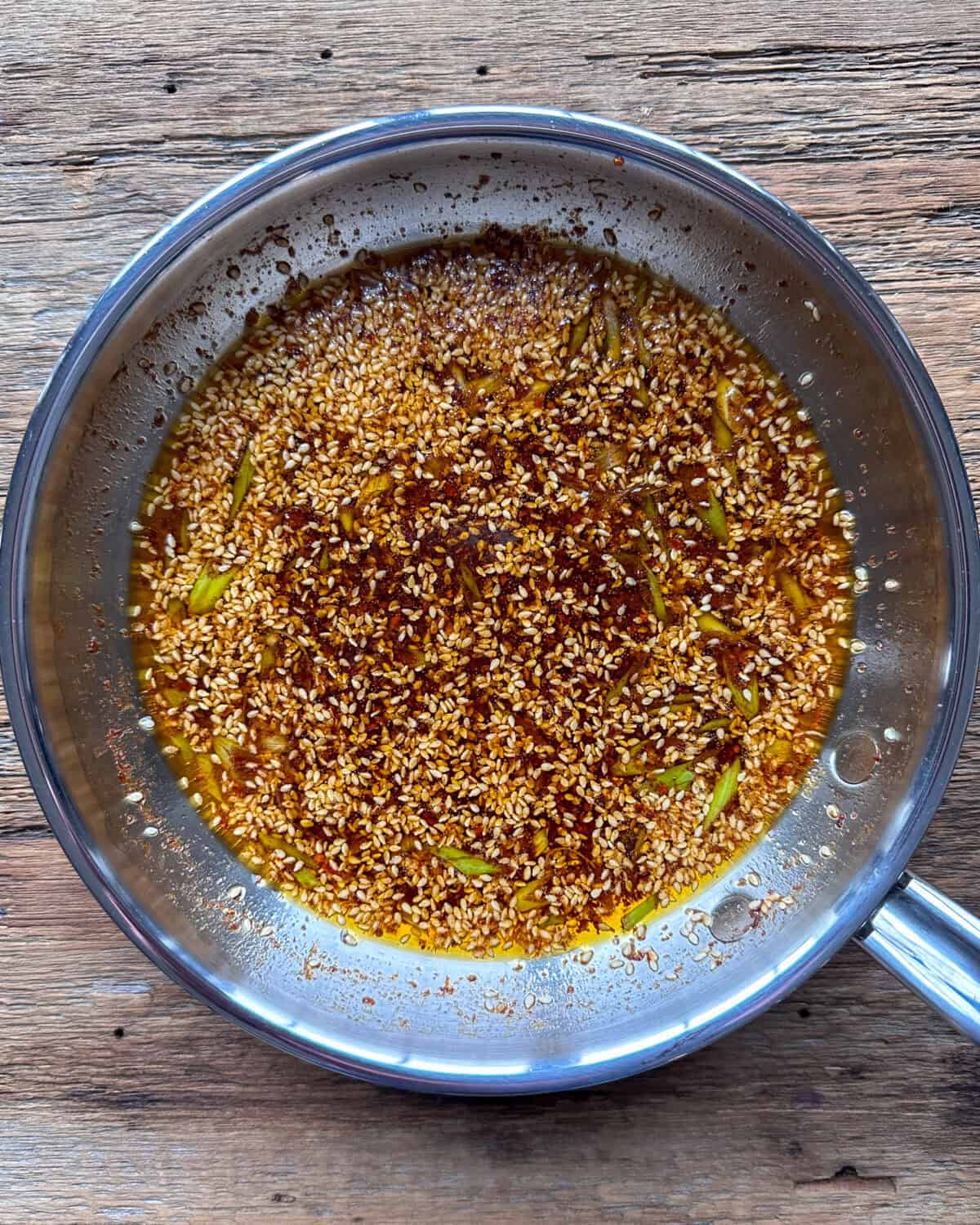 Homemade chili oil in a skillet.