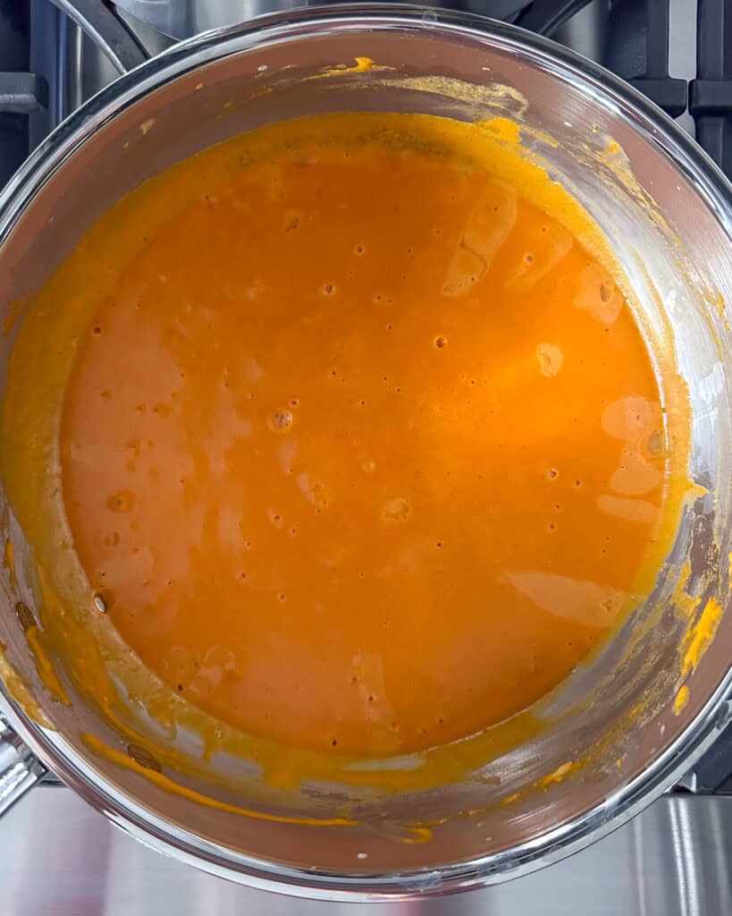 Gradually add in the milk and cream, stirring until smooth.