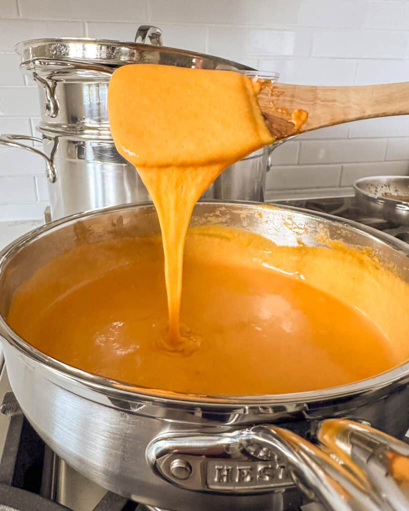 Add the cheddar and mozzarella cheese and stir until the sauce is smooth.