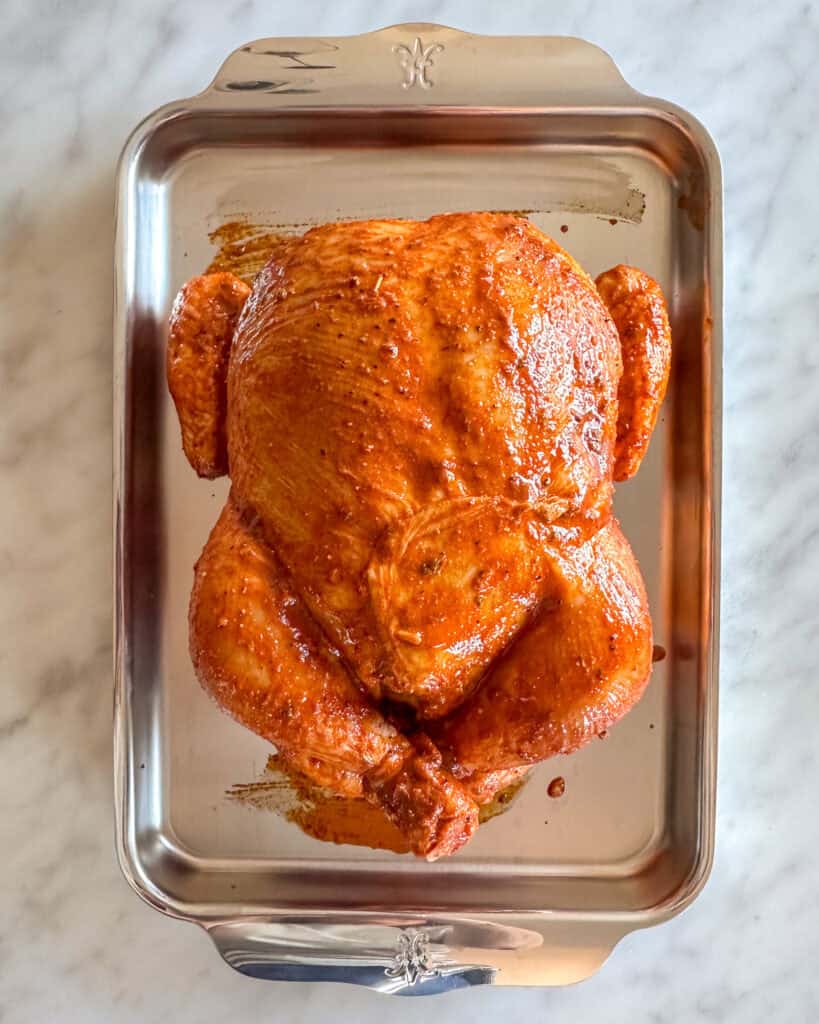 Marinated chicken on sheet pan ready to go into the oven.