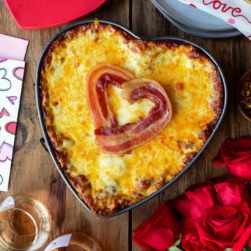 A heart shaped Lasagna with Bacon and Sausage in the filling and a bacon heart on the top.