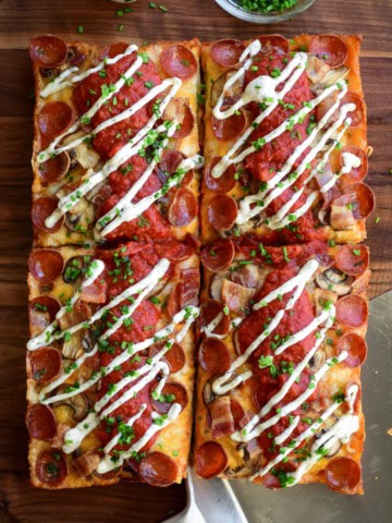 A Detroit-Style Pizza topped with Canadian pizza ingredients.