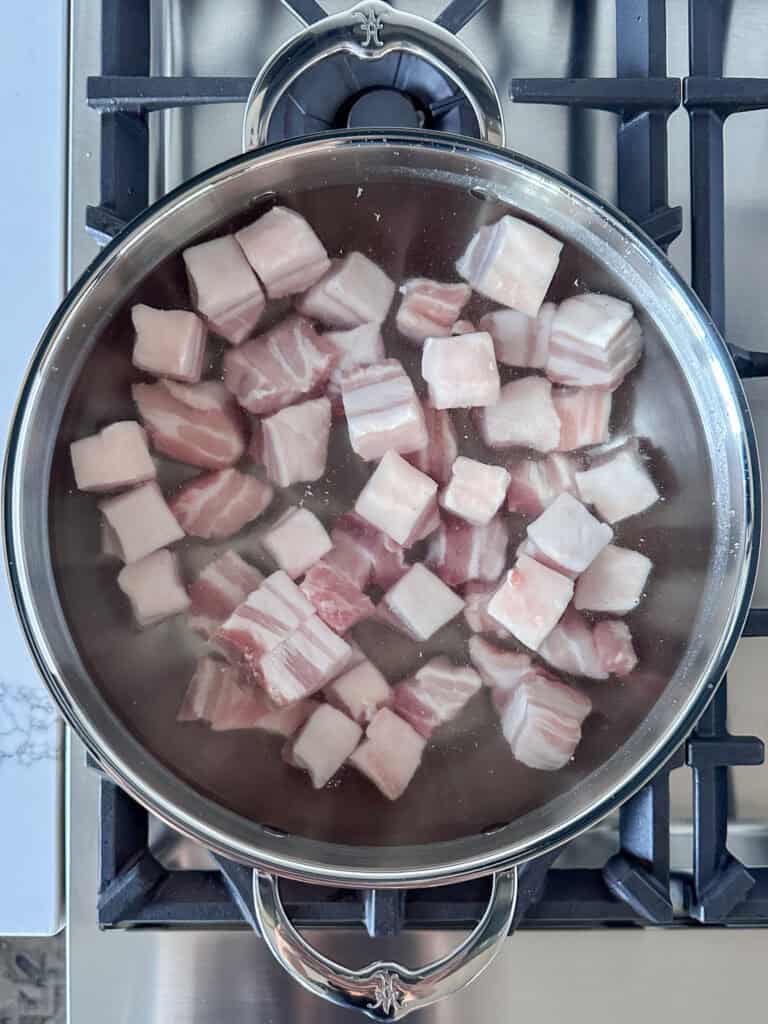 Place the pork belly cubes in water to boil.