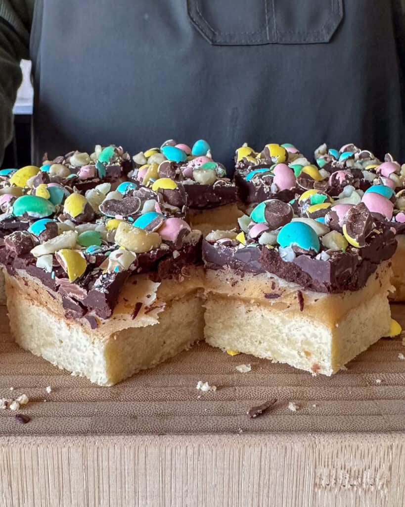 Mini Egg Millionaire’s Shortbread cut into pieces.