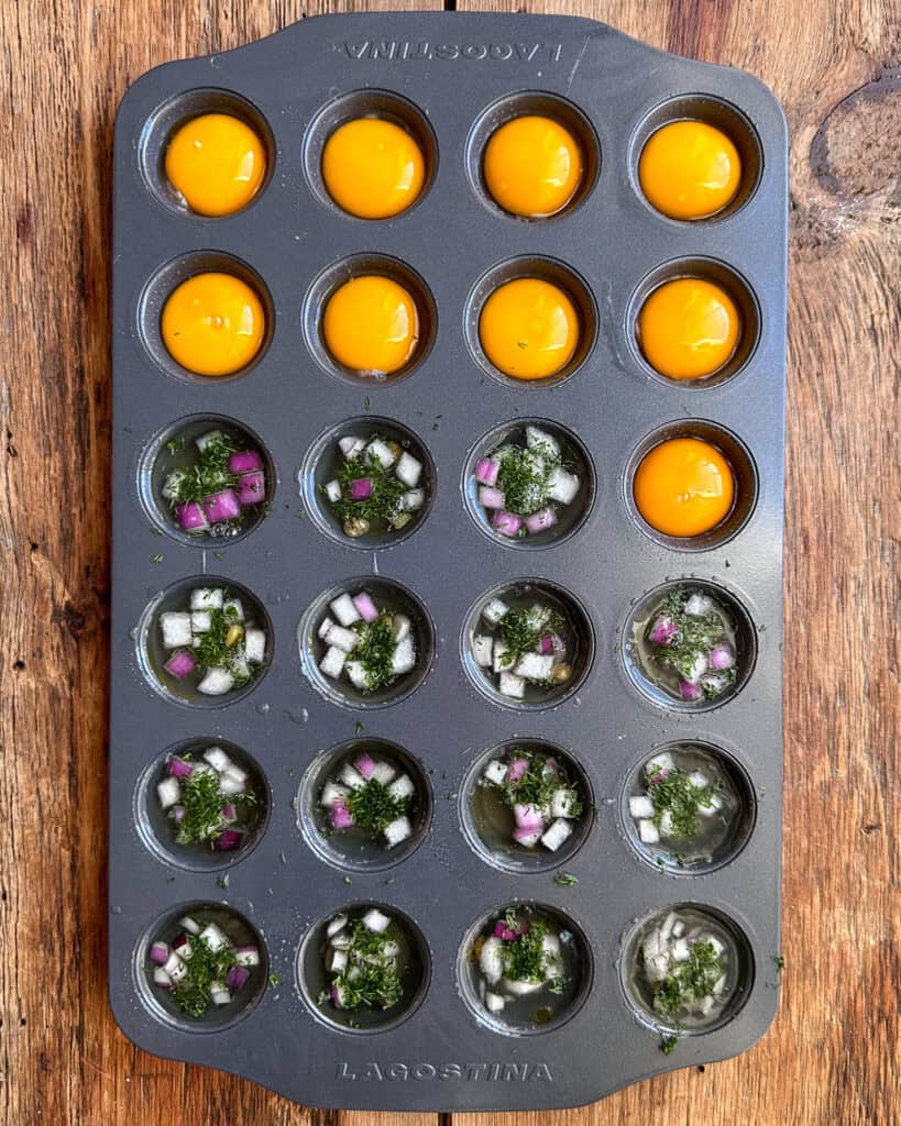 Baking eggs for deviled eggs in a muffin tin.