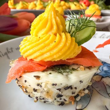 Muffin tin deviled eggs with smoked salmon, dill and everything bagel season.