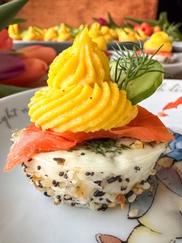 Muffin tin deviled eggs with smoked salmon, dill and everything bagel season.
