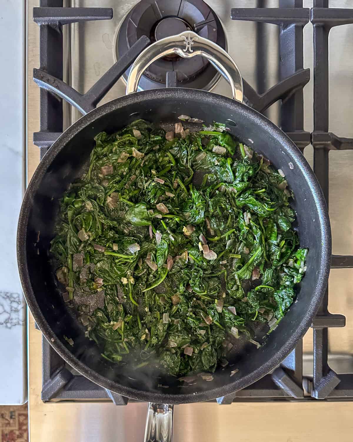 Preparing the spinach mixture.