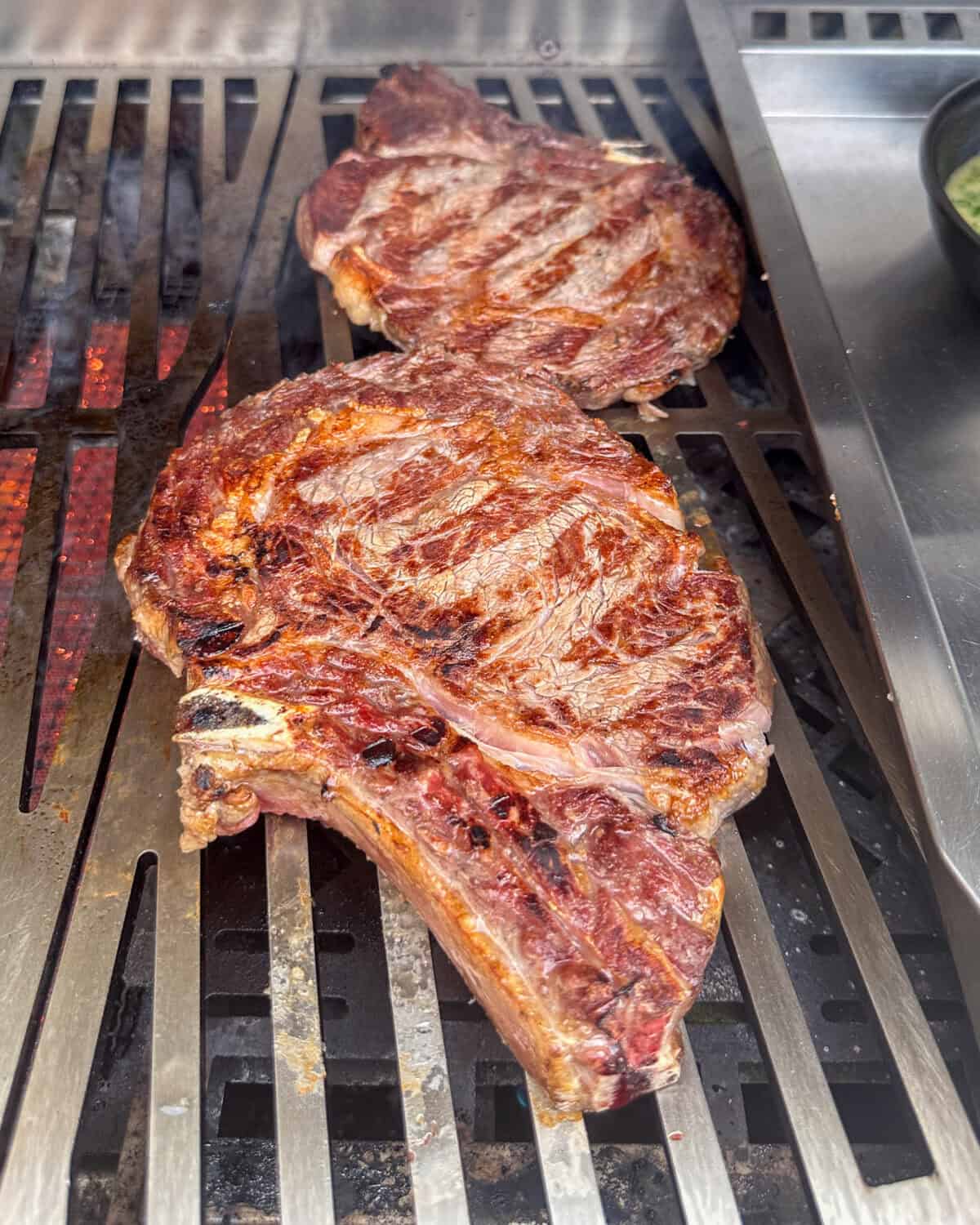Pictures of grilled ribeye steaks.