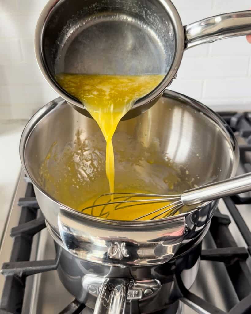 Drizzle in the melted butter a little at a time while whisking constantly, until the sauce is smooth and creamy, about 8 to 10 minutes.