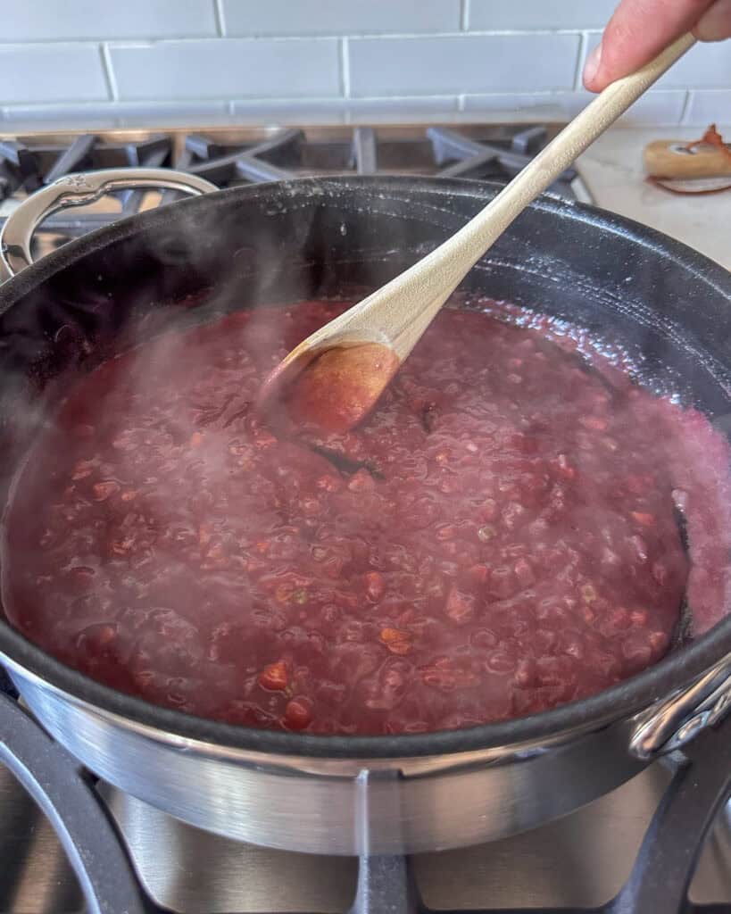 Add the red wine, stirring constantly to avoid lumps of flour.