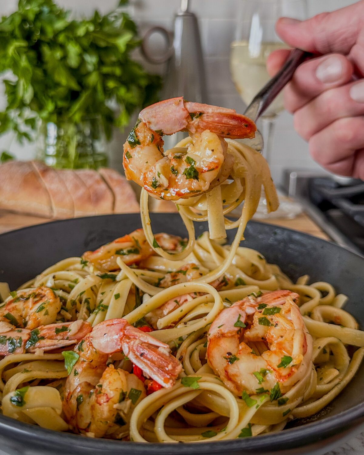A forkful of spicy garlic shrimp pasta.