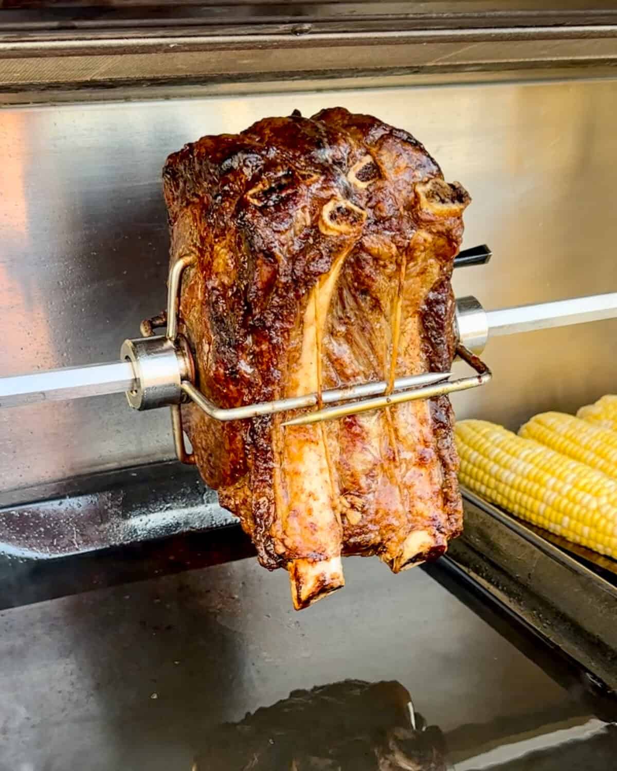 A bone in prime rib on the rotisserie.