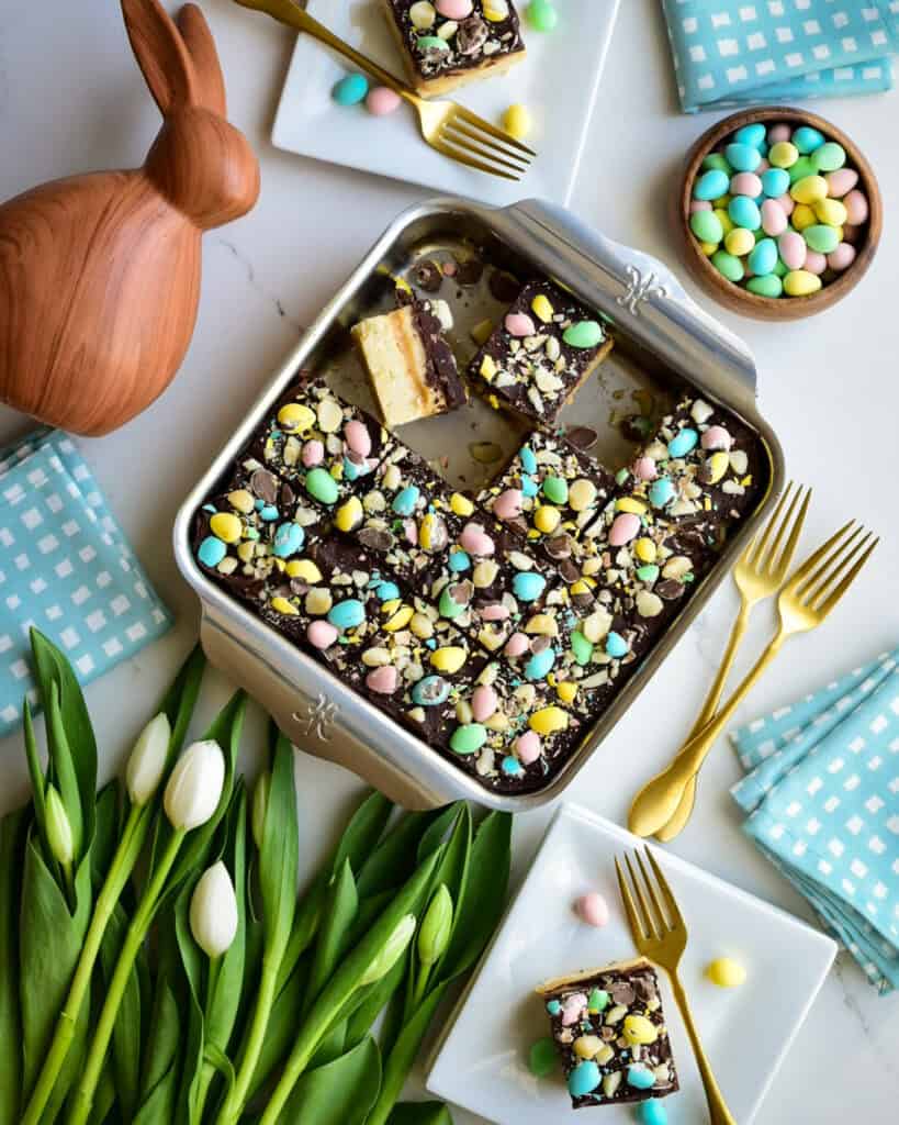 A baking pan with Mini Egg Millionaire’s Shortbread sliced up and served for Easter dessert.
