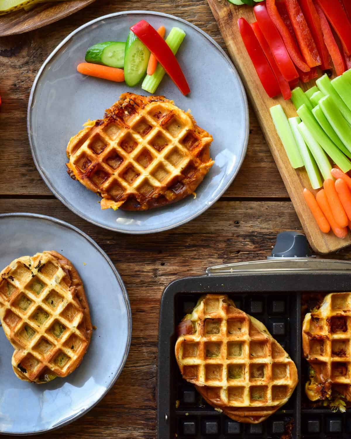 Waffle iron panini served with veggies.
