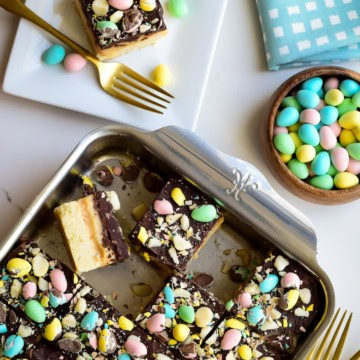 A baking pan with Mini Egg Millionaire’s Shortbread sliced up and served for Easter dessert.