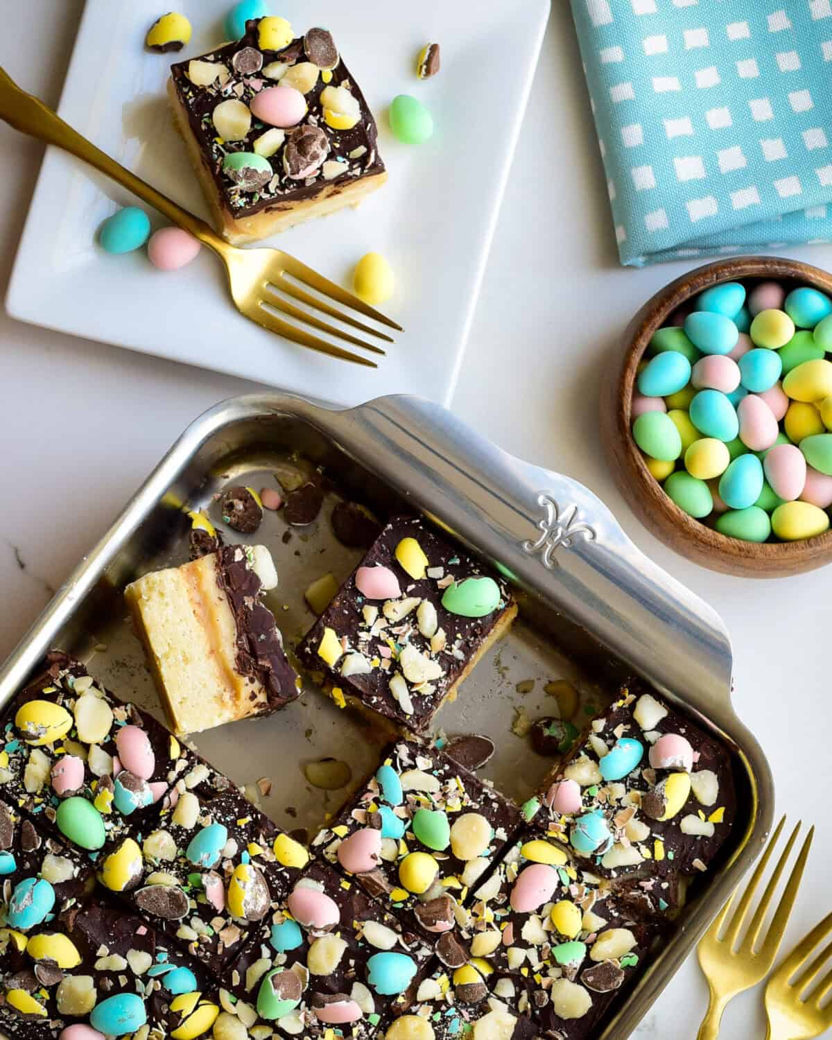 A baking pan with Mini Egg Millionaire’s Shortbread sliced up and served for Easter dessert.