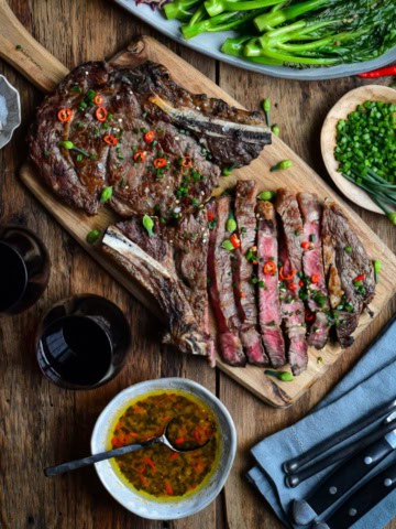 Two Grilled Ribeye Steaks served with an Asian-Inspired Sauce