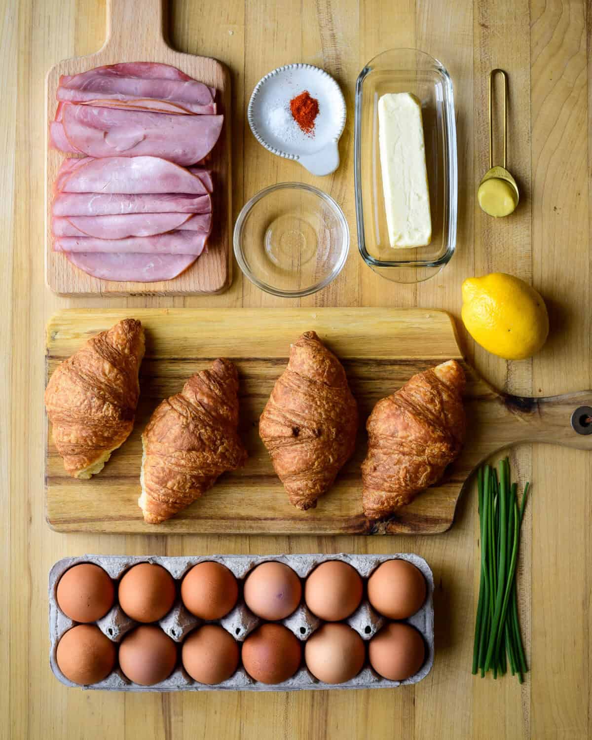 Ingredients to make eggs Benedict on croissants.